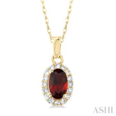 5x3 MM Oval Shape Garnet and 1/20 Ctw Round Cut Diamond Halo Semi-Precious Pendant with Chain in 14K Yellow Gold