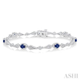 4X3 MM Oval Cut Sapphire and 1/10 Ctw Round Cut Diamond Precious Bracelet in 10K White Gold
