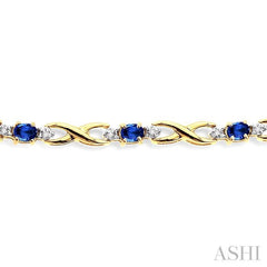 4x3 MM Oval Cut Sapphire and 1/10 Ctw Single Cut Diamond Bracelet in 10K Yellow Gold