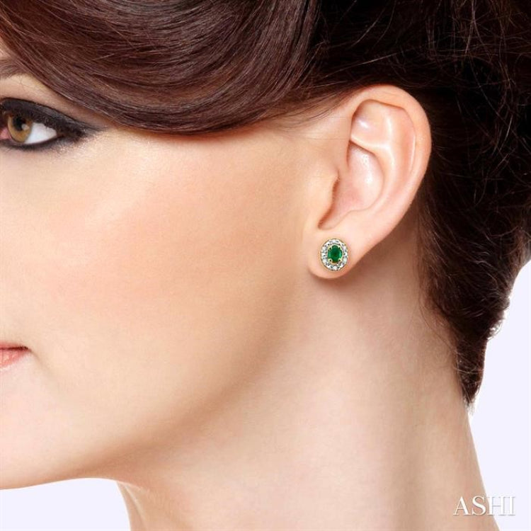 4x3 MM Oval Shaped Emerald and 1/10 ctw Single Cut Diamond Earrings in 14K Yellow Gold