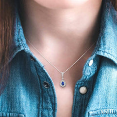 6x4 MM Pear Shape Sapphire and 1/6 ctw Round Cut Diamond Pendant in 14K White Gold with Chain