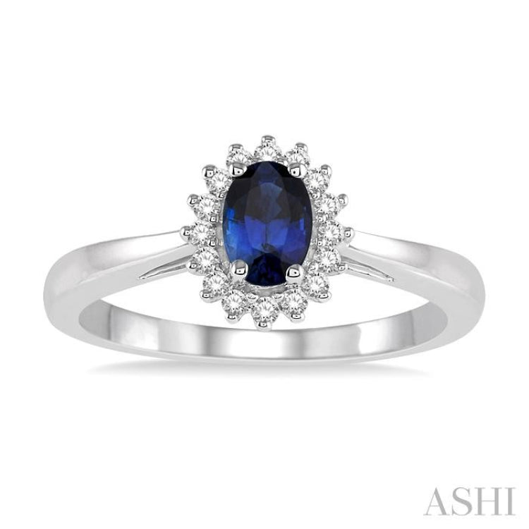 6X4 MM Oval Cut Sapphire Center and 1/8 ctw Round Cut Diamond Halo Precious Stone Ring in 10K White Gold