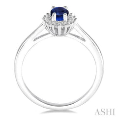 6X4 MM Oval Cut Sapphire Center and 1/8 ctw Round Cut Diamond Halo Precious Stone Ring in 10K White Gold