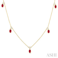 5x3 MM Oval Shape Ruby and 1/8 ctw Round Cut Diamonds Precious Station Necklace in 10K Yellow Gold